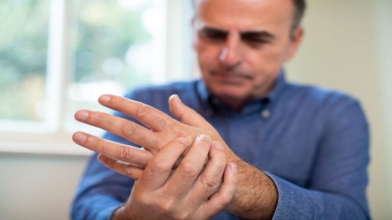 Mature Man Suffering With Repetitive Strain Injury
