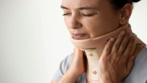 Woman Patient Using Neck Brace