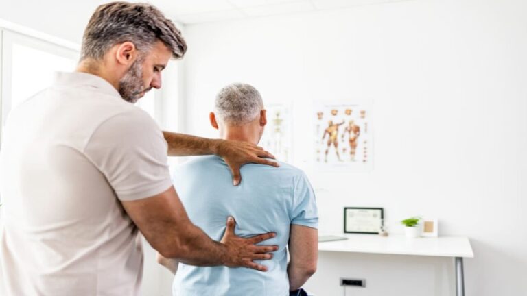 Chiropractor Doing Back Adjustment for His Man Client