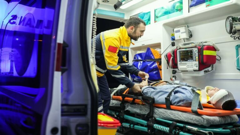 First Aid to Young Man Accident in Ambulance