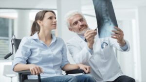 Radiologist Examining Woman's Xray