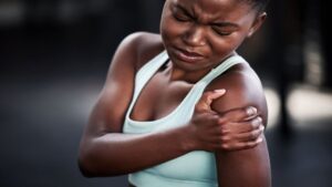 Young Black Woman Suffering from Shoulder Pain