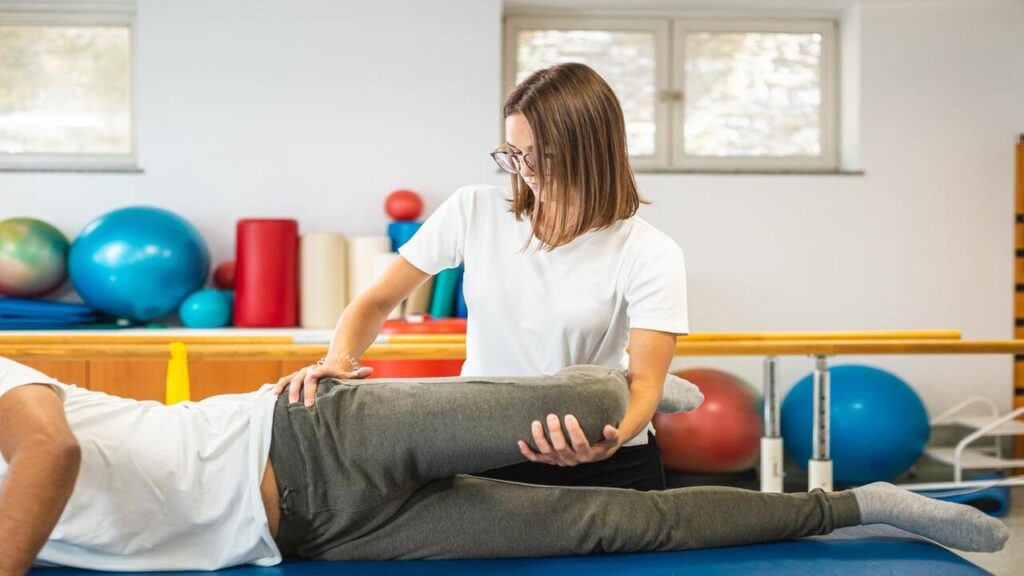 Female Chiropractor Treating His Patient from Bursitis
