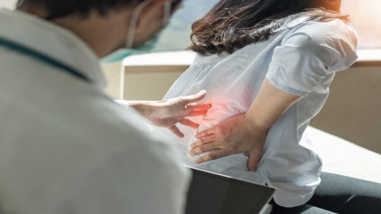 Woman Patient Visits a Doctor to Check Her Lower Back Pain